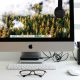 Free Stylish home office workspace featuring a computer setup with accessories. Stock Photo